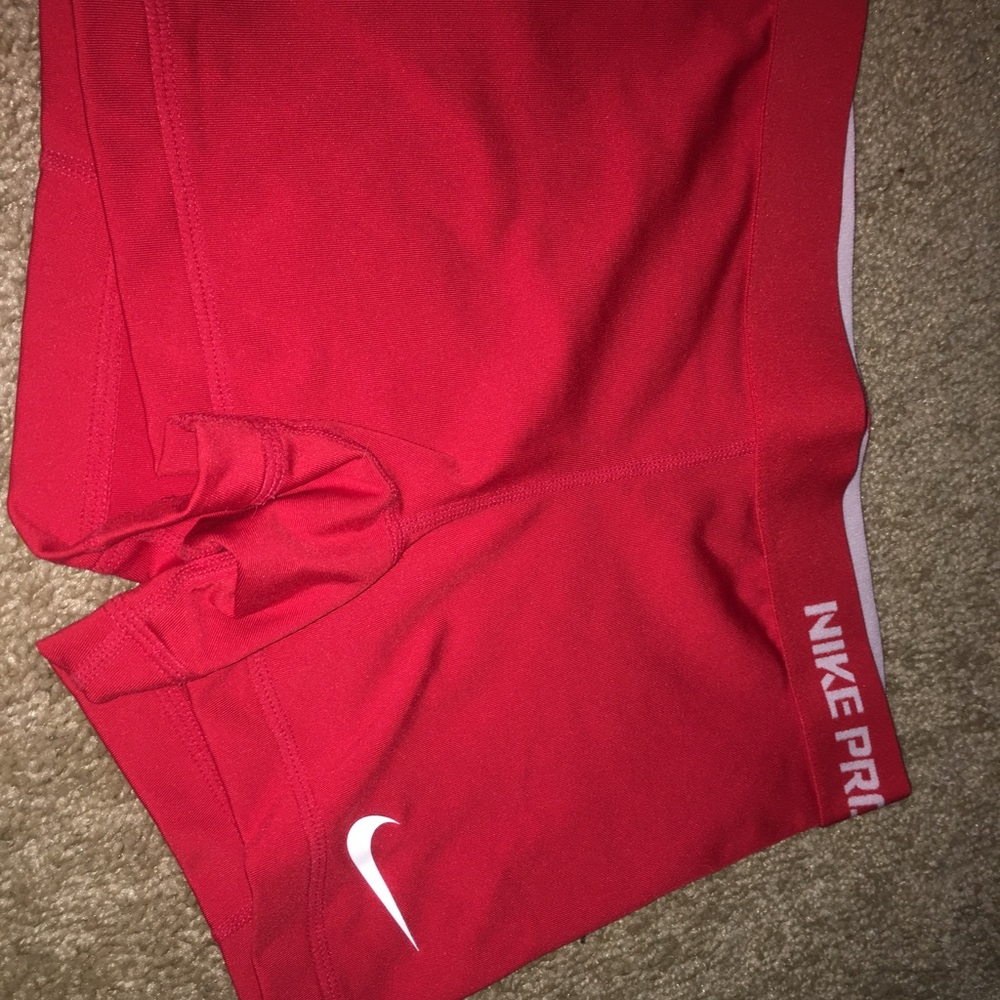 Red Nike Pros, size XS